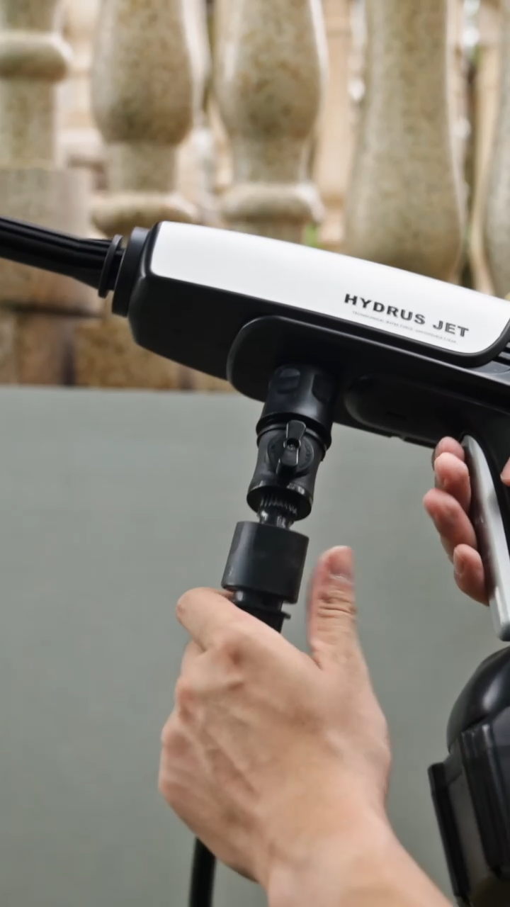 Snapping the quick-connect water hose into the inlet connector at the front of the Hydrus Jet